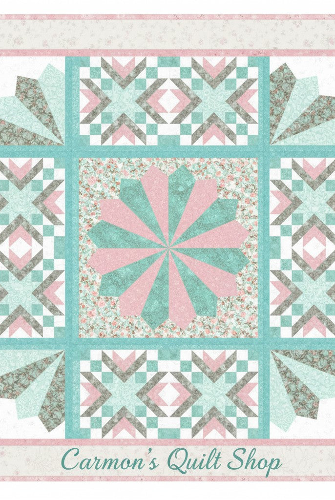 Carmon's Quilt Shop Floating Dresden quilt kit featuring floral Northcott cotton fabrics in pink, teal, and grey.