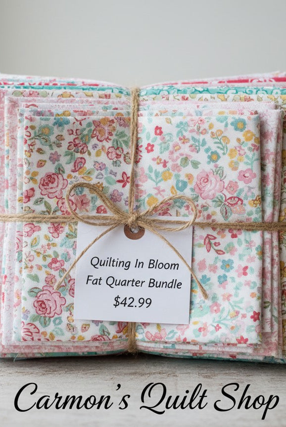 Carmon's Quilt Shop Quilting in Bloom fat quarter bundle of 13 floral cotton fabrics tied with twine