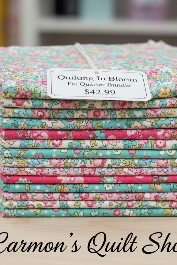 Carmon's Quilt Shop Quilting In Bloom fat quarter bundle featuring 13 floral cotton fabric squares in pink and teal.