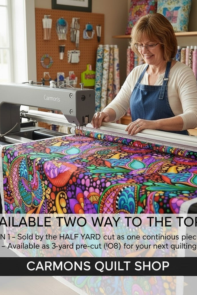 Carmon's Quilt Shop wide floral geometric cotton fabric with vibrant multi-colored patterns on a longarm quilting machine