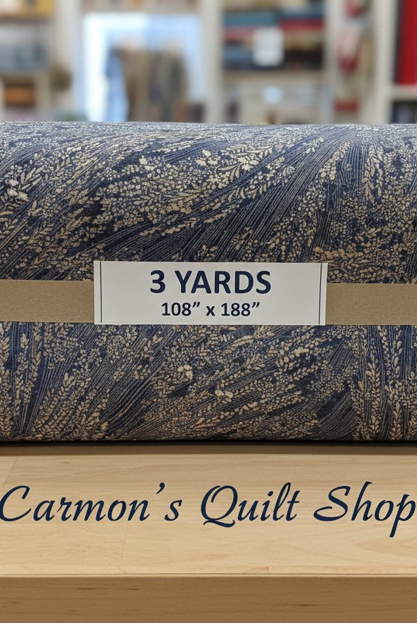 Carmon's Quilt Shop Meadow Breeze 108-inch wide cotton quilt backing fabric with a blue and brown floral print.