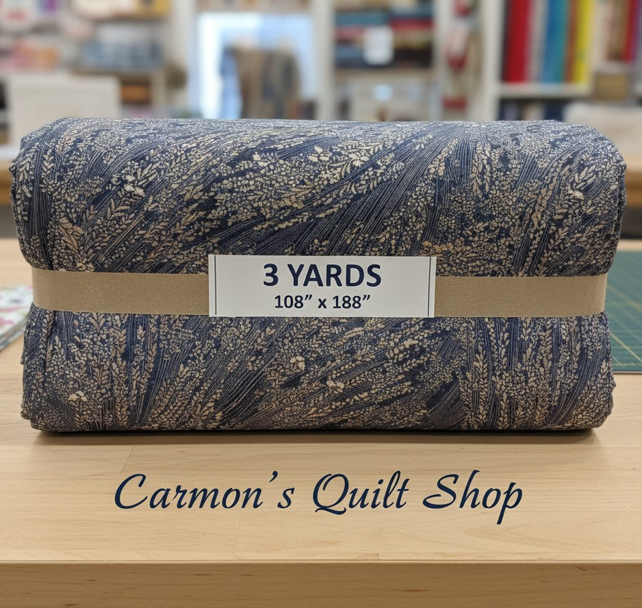 Carmon's Quilt Shop Meadow Breeze 108-inch wide cotton quilt backing fabric with a blue and brown floral print.