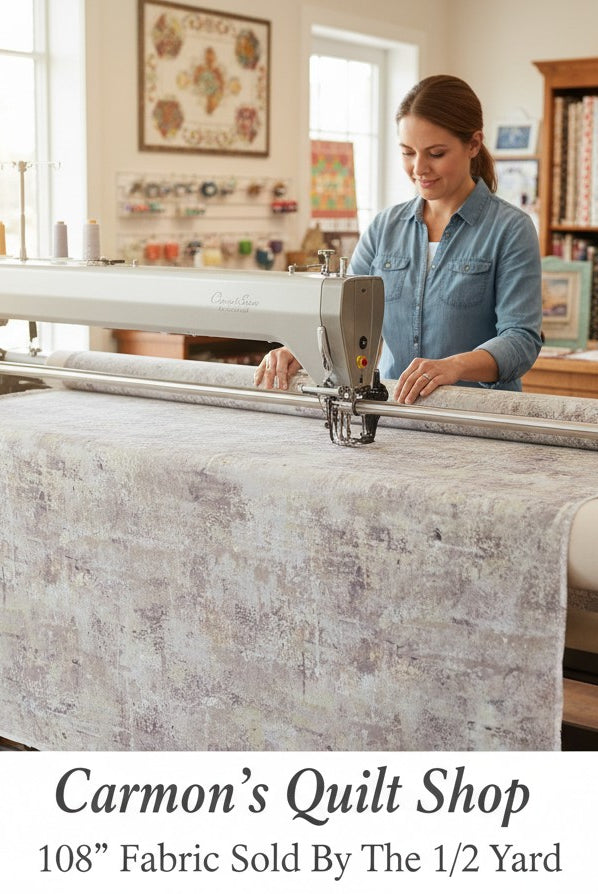 Carmon's Quilt Shop gray mottled blender quilting cotton fabric on a longarm machine in a sewing studio