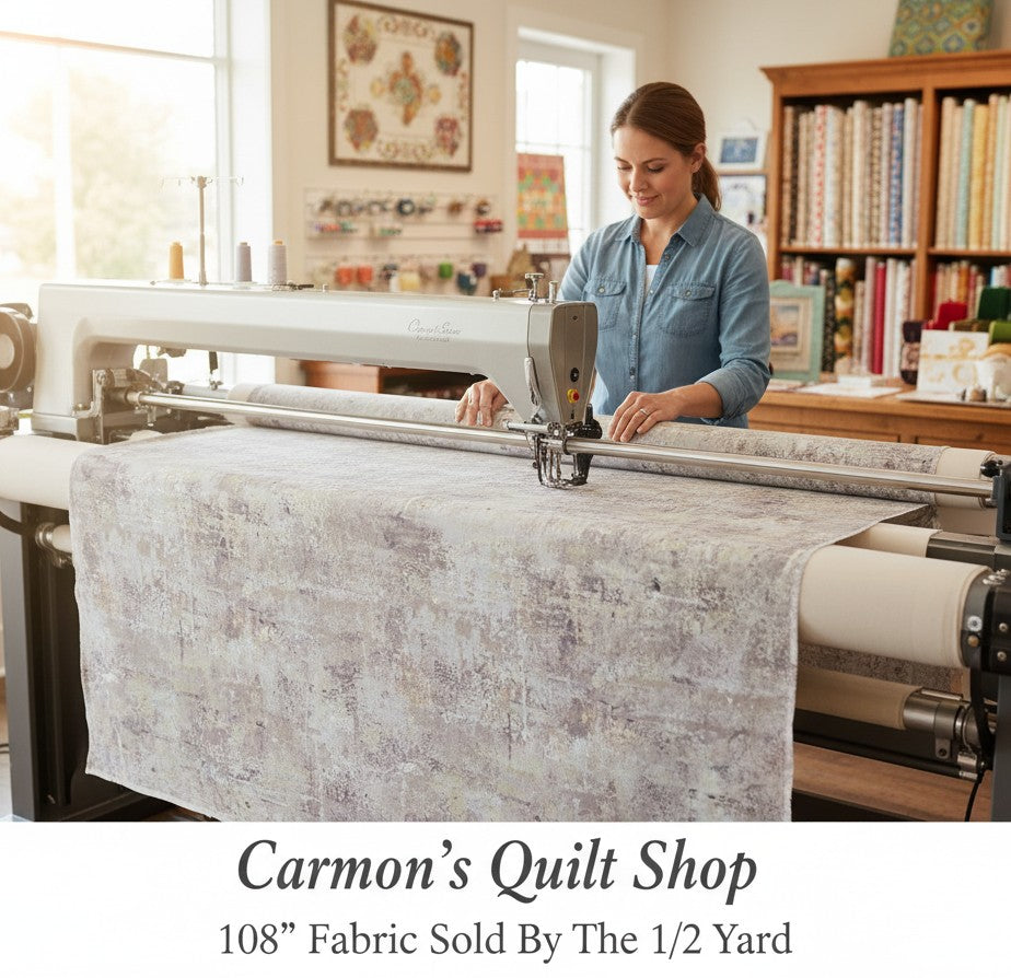 Carmon's Quilt Shop gray mottled blender quilting cotton fabric on a longarm machine in a sewing studio