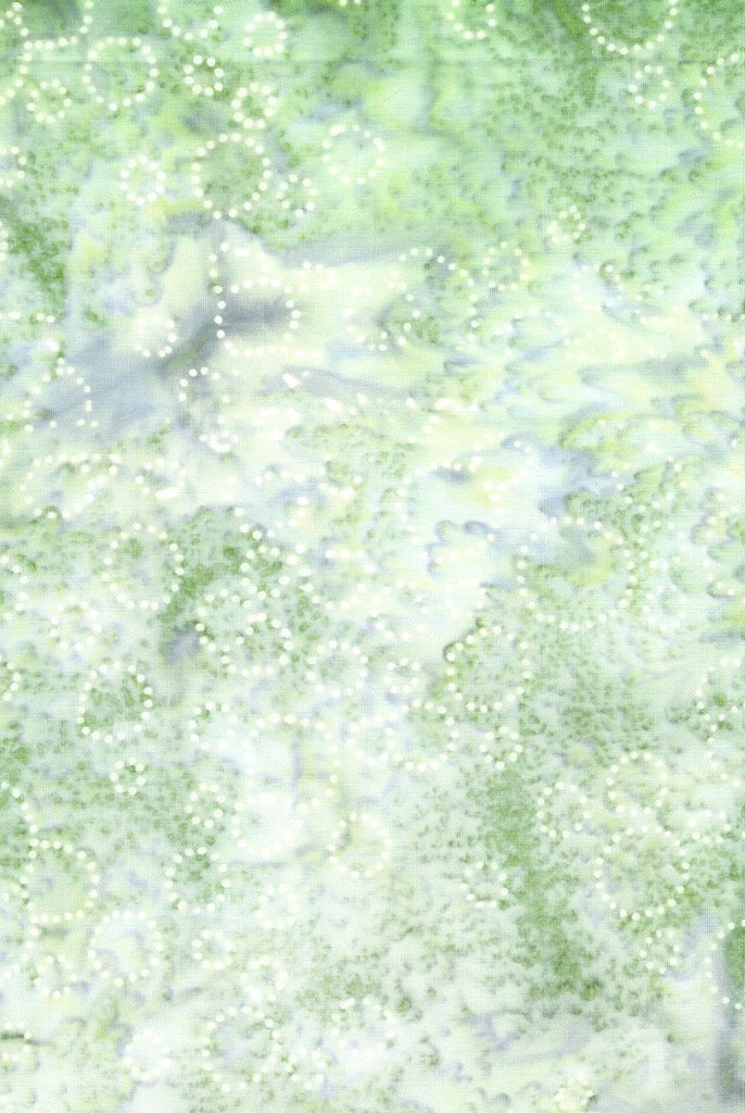 Carmon's Quilt Shop Vintner's Treasure Island Batik fabric in light green with white dotted texture