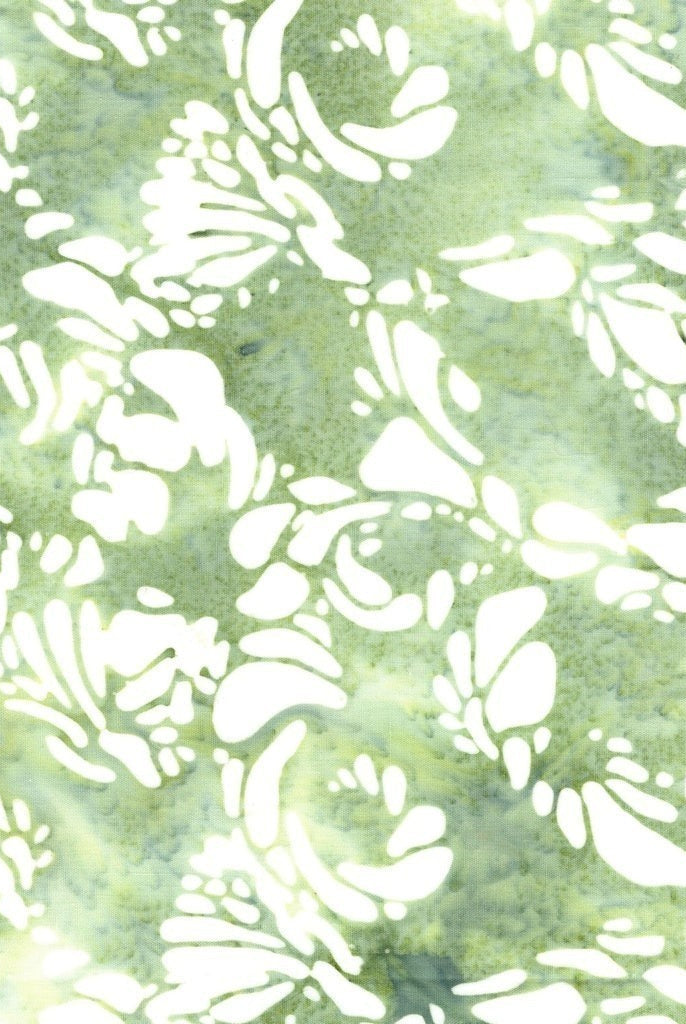 Carmon's Quilt Shop Island Batik Vintner's Treasure fabric in green with white floral patterns for quilting.