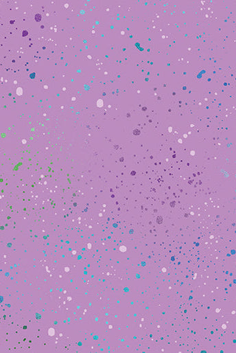 Carmon's Quilt Shop Dragonfly Wonder lavender fabric with a colorful speckled paint splatter pattern