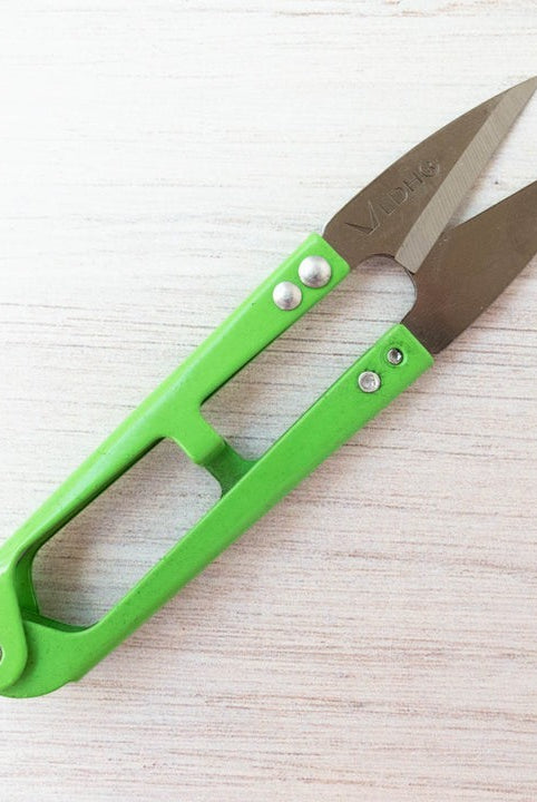 Carmon's Quilt Shop LDH Thread Snips XL with bright green handles and sharp metal blades for precision sewing tasks.