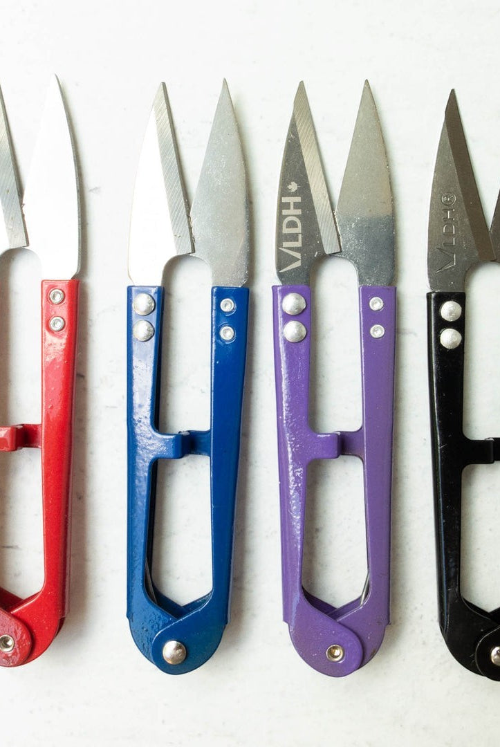 Carmon's Quilt Shop LDH Thread Snips XL in red, blue, purple, and black for precision sewing and quilting tasks.