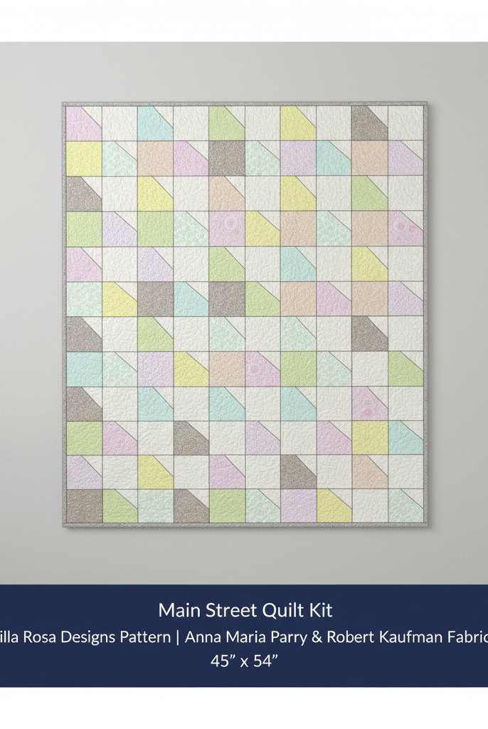 Carmon's Quilt Shop Main Street quilt kit featuring colorful Anna Maria Parry and Robert Kaufman geometric fabrics.
