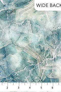 Carmon's Quilt Shop Northcott Smooth Sailing marble pattern wide backing cotton fabric in teal, blue, and white.