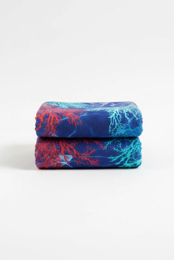 Carmon's Quilt Shop Oceana Coral 108 inch fabric featuring orange and blue coral reef patterns on deep blue cotton