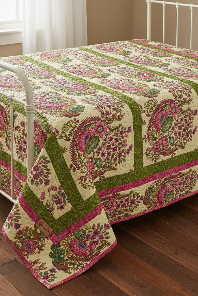 Carmon's Quilt Shop Outstretched Cream Backing 108" 100% cotton fabric with a vibrant floral pattern in pink, green, and blue.