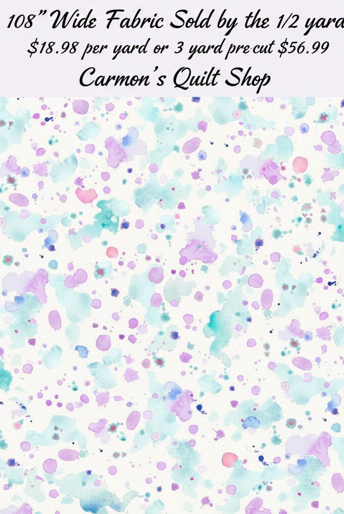 Carmon's Quilt Shop 108 inch wide cotton fabric featuring a colorful paint splatter pattern on a white background.