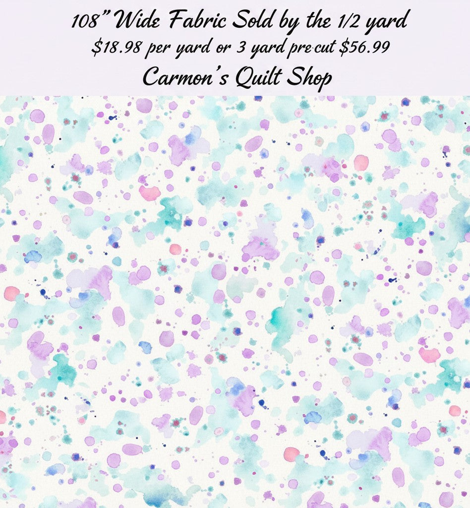 Carmon's Quilt Shop 108 inch wide cotton fabric featuring a colorful paint splatter pattern on a white background.