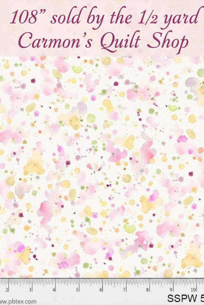 Carmon's Quilt Shop 108-inch wide cotton fabric with a colorful pink, yellow, and green paint splatter design.