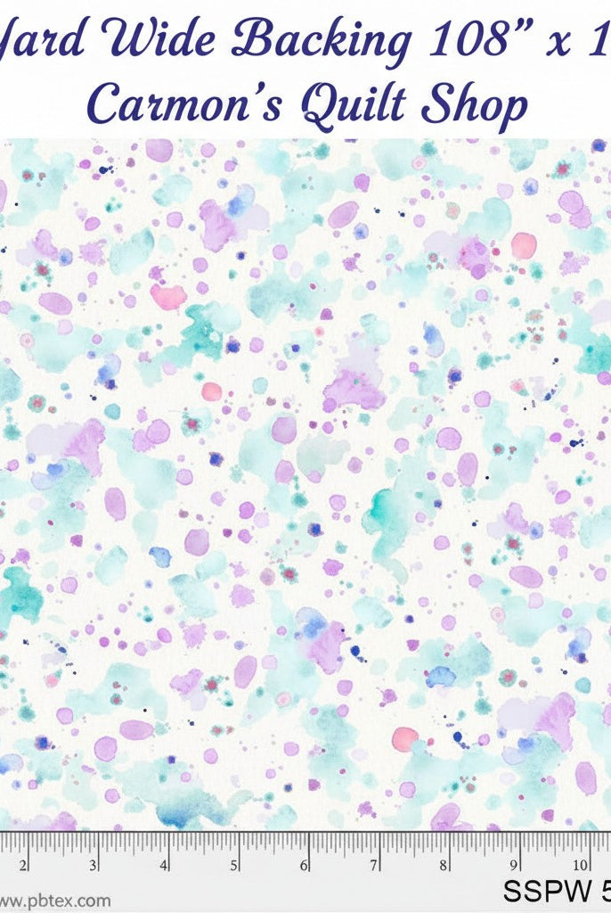 Carmon's Quilt Shop 108 inch wide cotton backing fabric featuring a colorful paint splatter pattern on white