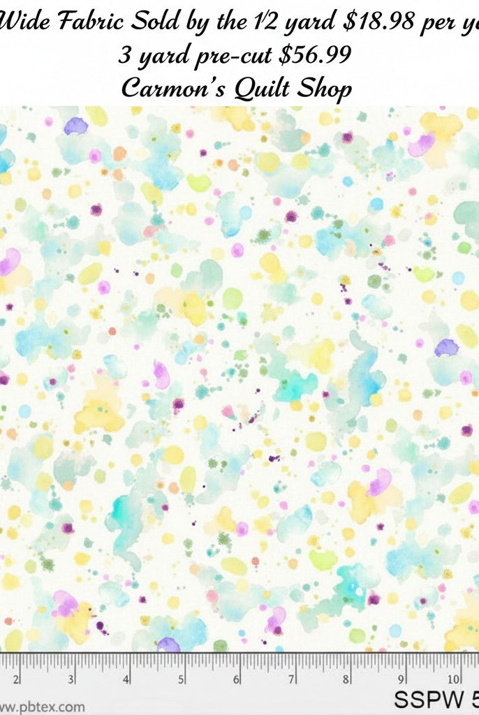 Carmon's Quilt Shop 108-inch wide cotton fabric with a colorful watercolor paint splatter pattern on white background