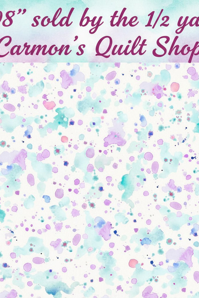 Carmon's Quilt Shop 108 inch wide cotton fabric featuring a colorful purple and teal paint splatter design.