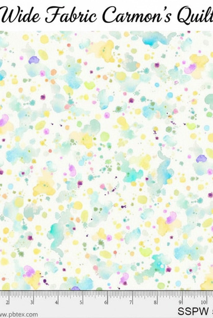 Carmon's Quilt Shop 108 inch wide cotton fabric featuring a colorful paint splatter pattern on a white background.