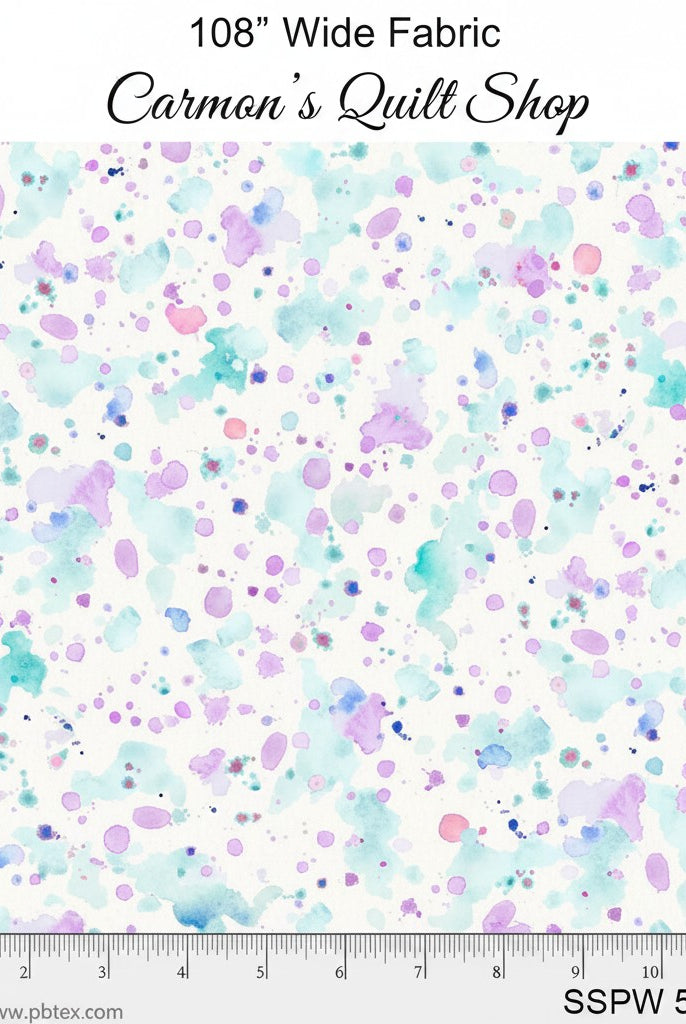 Carmon's Quilt Shop 108 inch wide cotton quilting fabric featuring a colorful paint splatter design on white.