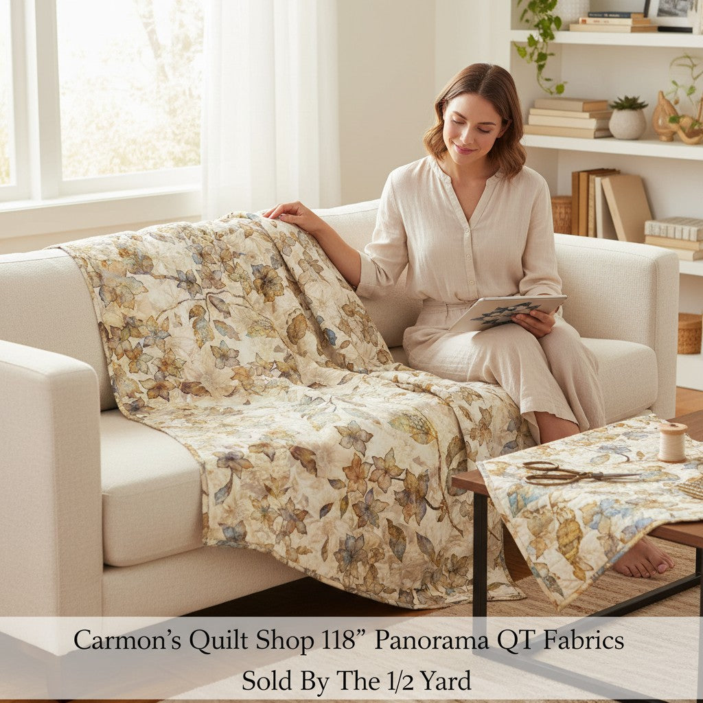 Carmon's Quilt Shop 118 inch wide Panorama tonal floral cotton fabric draped over a sofa with a woman sitting nearby