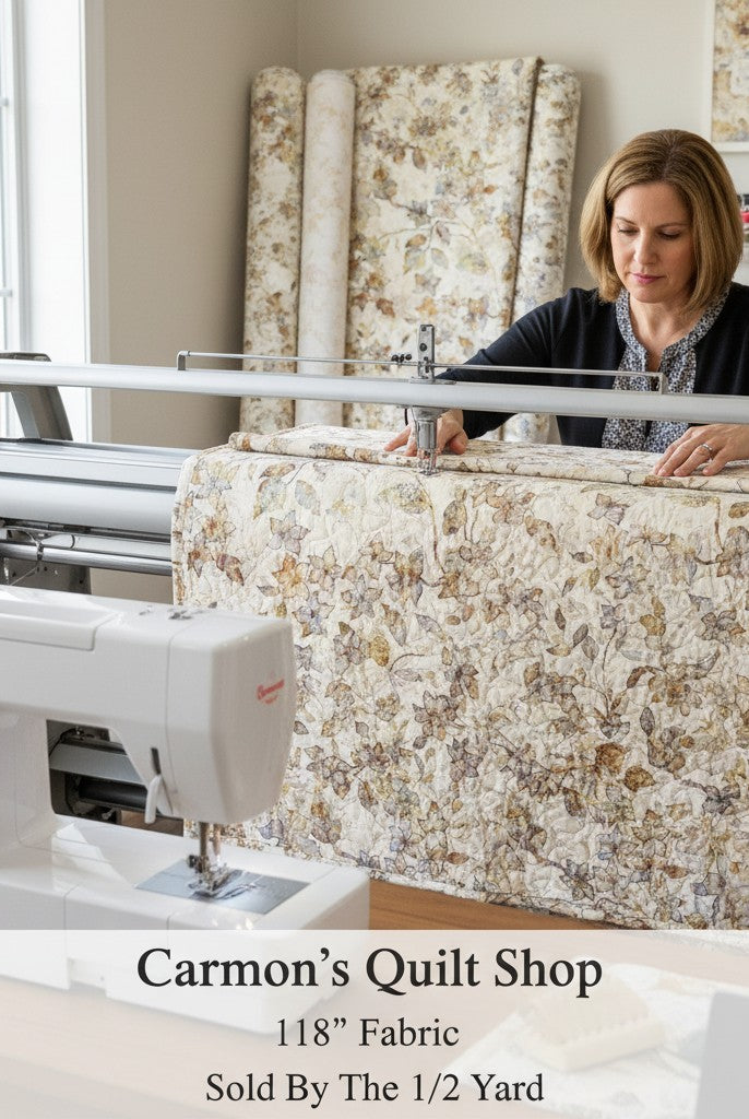 Carmon's Quilt Shop Panorama tonal floral 118-inch wide cotton quilting fabric being machine quilted by a woman.