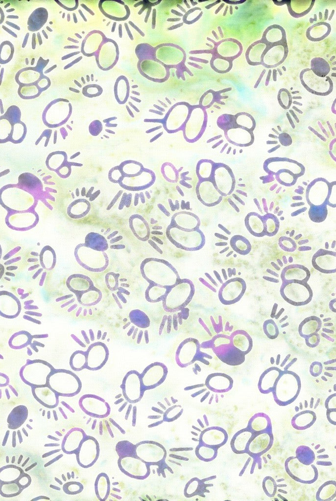 Carmon's Quilt Shop Island Batik fabric featuring purple and green abstract circular motifs on a light background