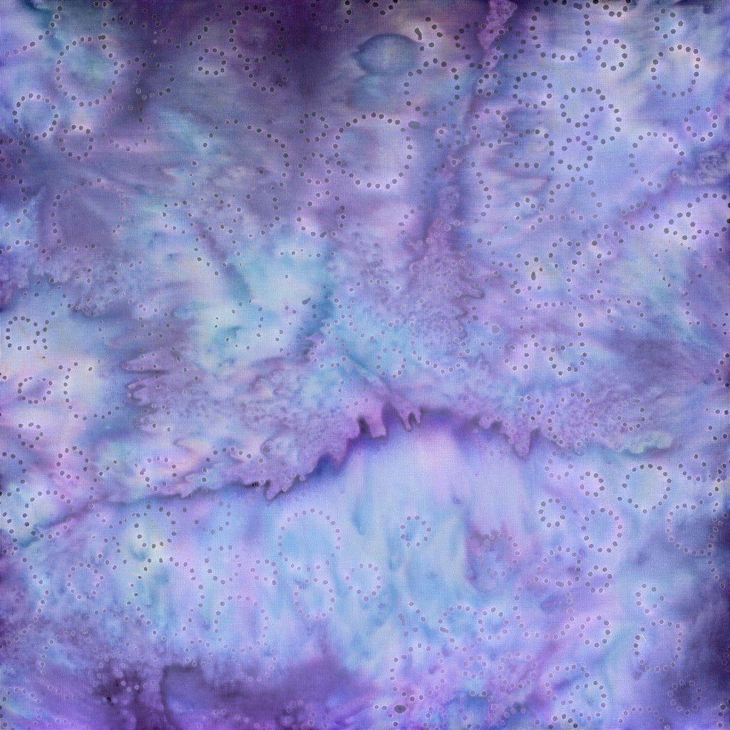 Carmon's Quilt Shop Vintner's Treasure purple and green batik cotton fabric with a delicate circular dot pattern.