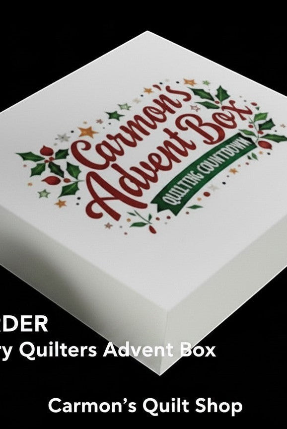 Carmon's Quilt Shop 24-day quilting advent calendar box with festive holiday branding on a white gift box