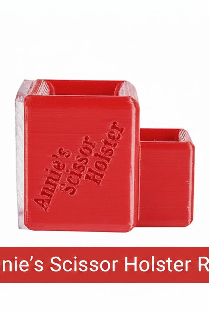 Carmon's Quilt Shop red Annie's Scissor Holster with two slots for organizing sewing tools on a craft table.