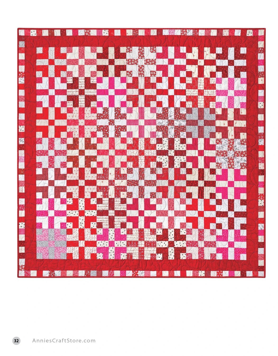 Carmon's Quilt Shop two-color red and white quilt featuring a geometric block pattern with a decorative border
