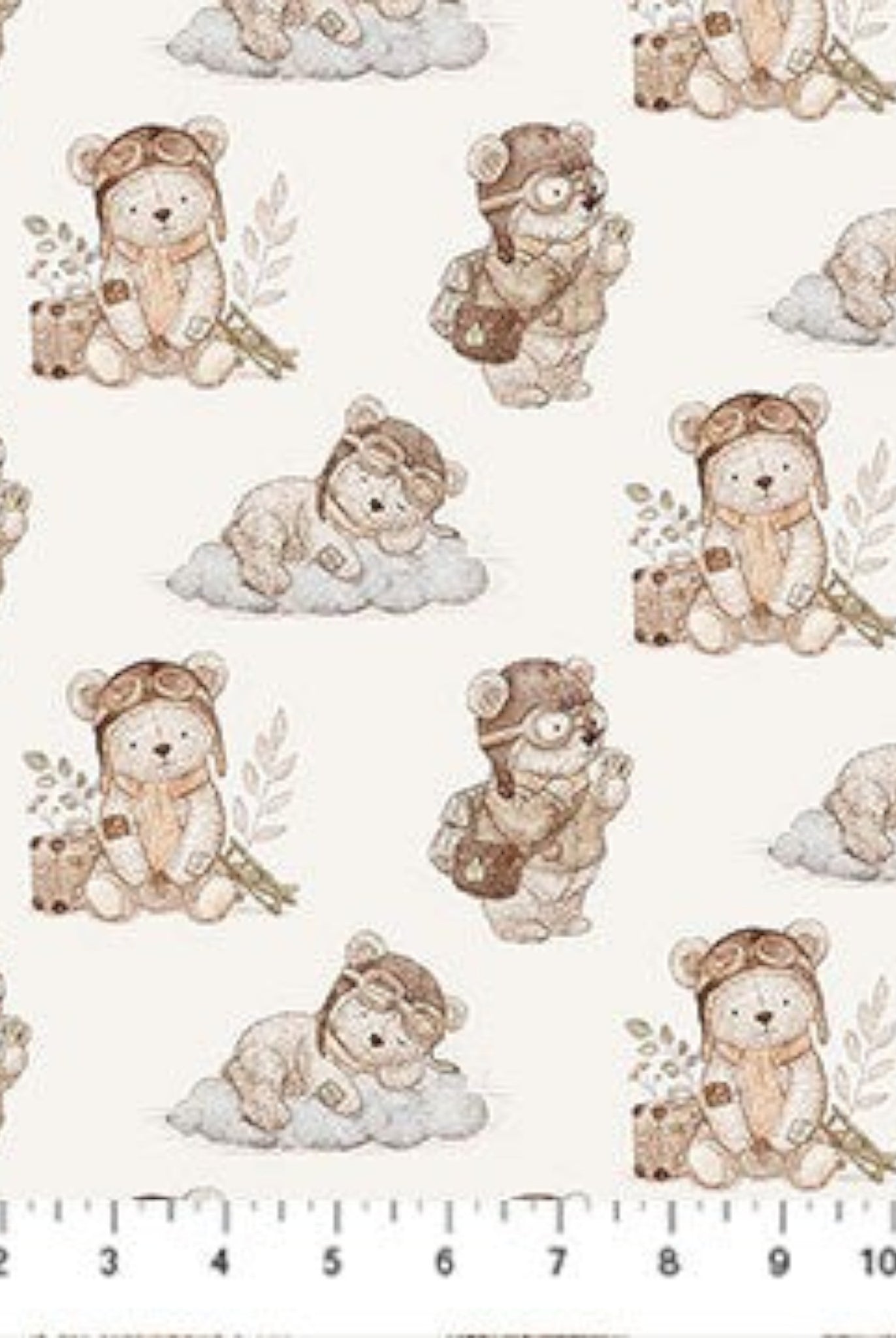 Carmon's Quilt Shop Soaring Dreams cream 100% cotton fabric with illustrated teddy bears in aviator gear on clouds. Jessica Yon Lo designer.