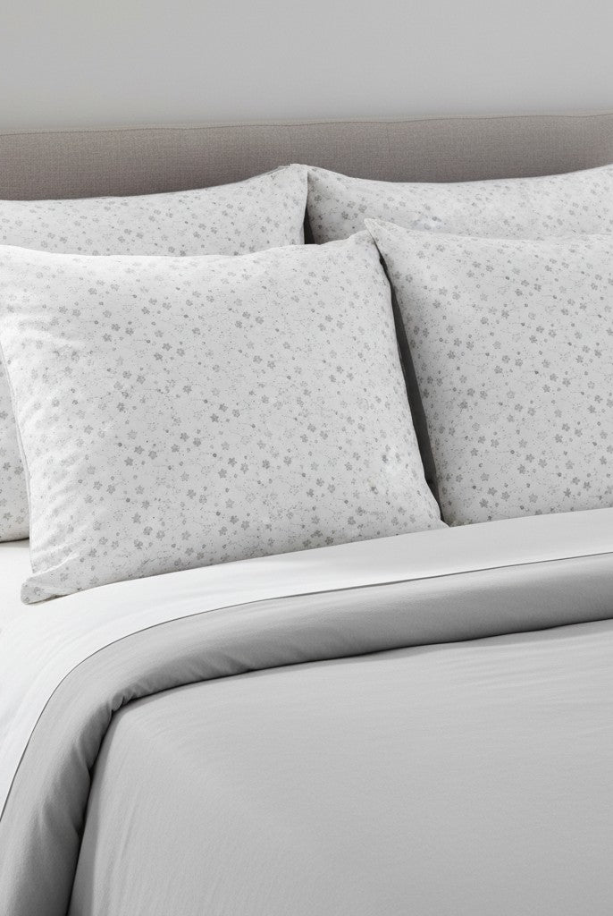 Carmon's Quilt Shop Soaring Dreams white stars fabric by Jessica Yon Lo, 100% cotton, gray-blue hue.