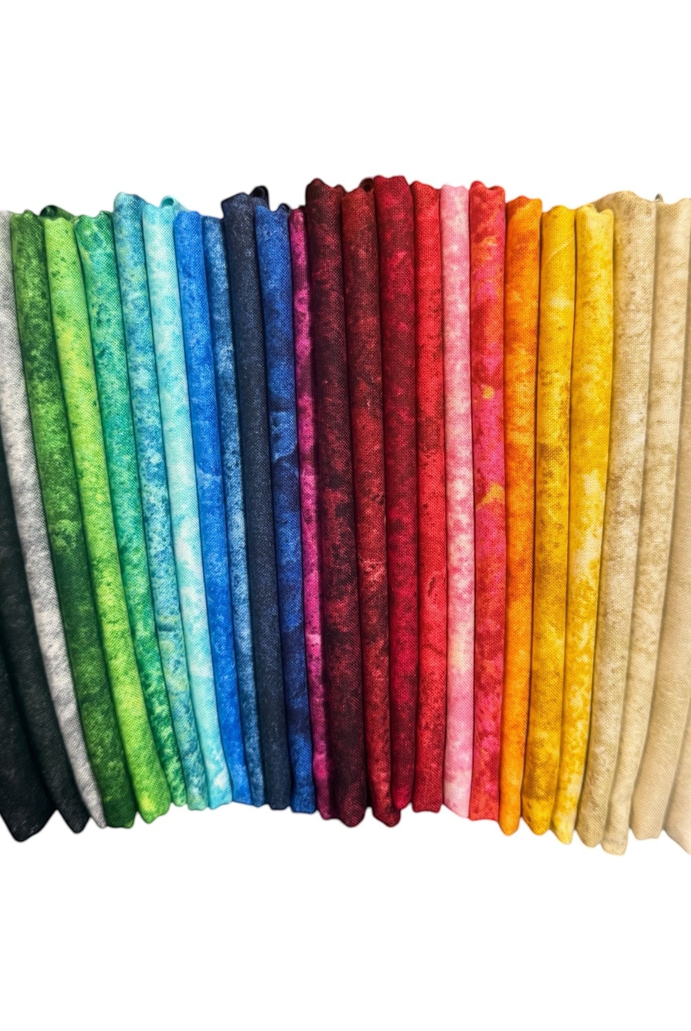Carmon's Quilt Shop Stonehenge Basics 28-piece bundle of premium cotton quilting fabric in a rainbow of colors.