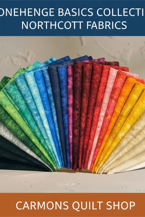 Carmon's Quilt Shop Stonehenge Basics Northcott cotton fabric collection in a vibrant rainbow fan display