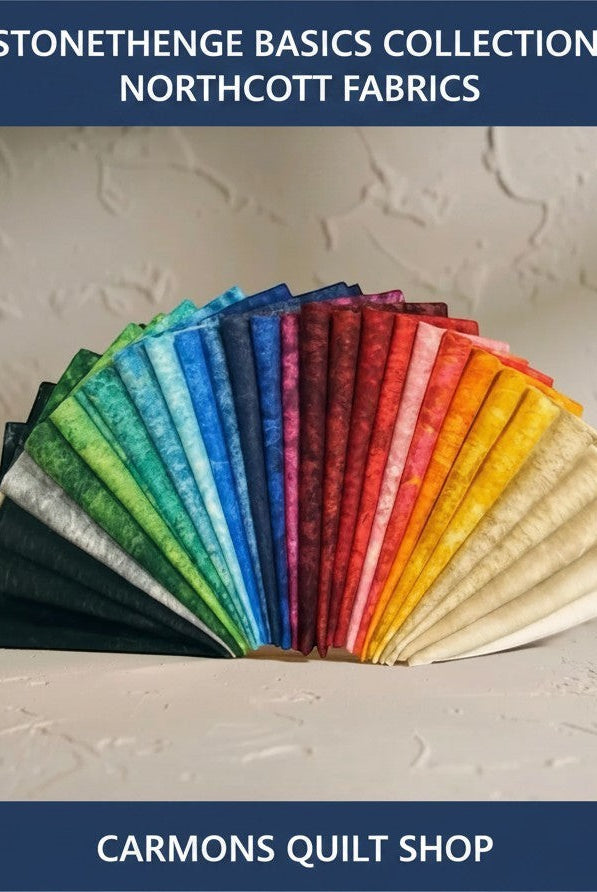 Carmon's Quilt Shop Stonehenge Basics 28-piece fat quarter bundle of premium cotton quilting fabric in a rainbow fan.