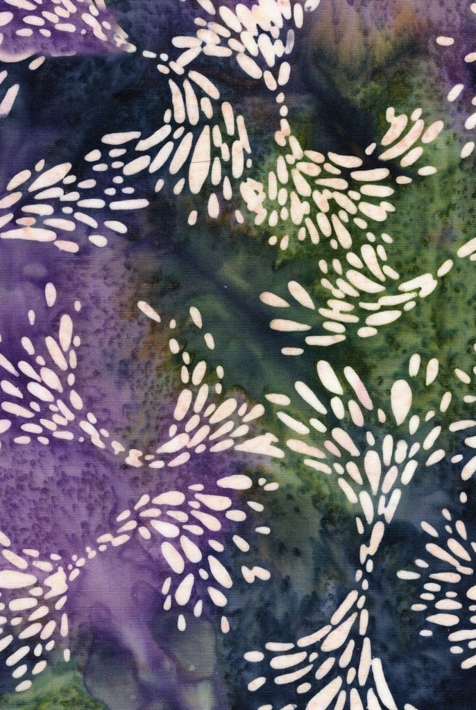 Carmon's Quilt Shop Island Batik Vintner's Treasure fabric with purple and green starburst patterns on cotton.