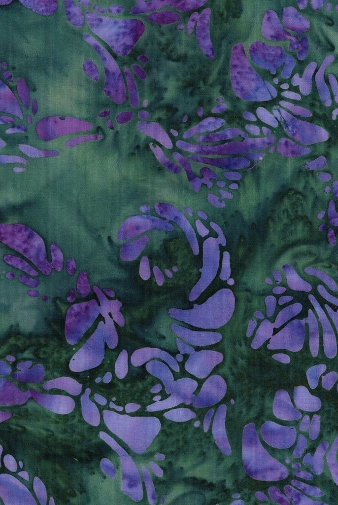 Carmon's Quilt Shop Vintner's Treasure Island Batik fabric in purple and green with a swirling organic pattern