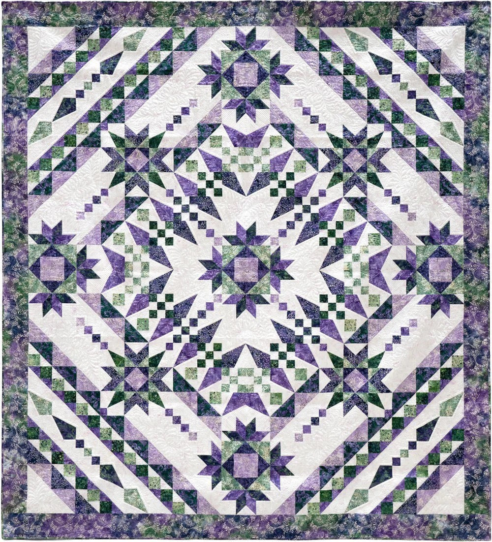 Carmon's Quilt Shop Vintner's Treasure batik quilt featuring a purple and green starburst geometric pattern in cotton.