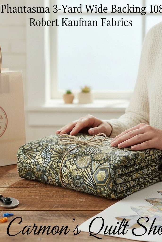 Carmon's Quilt Shop walnut geometric starburst hexagon cotton quilt backing fabric folded on a wooden table.
