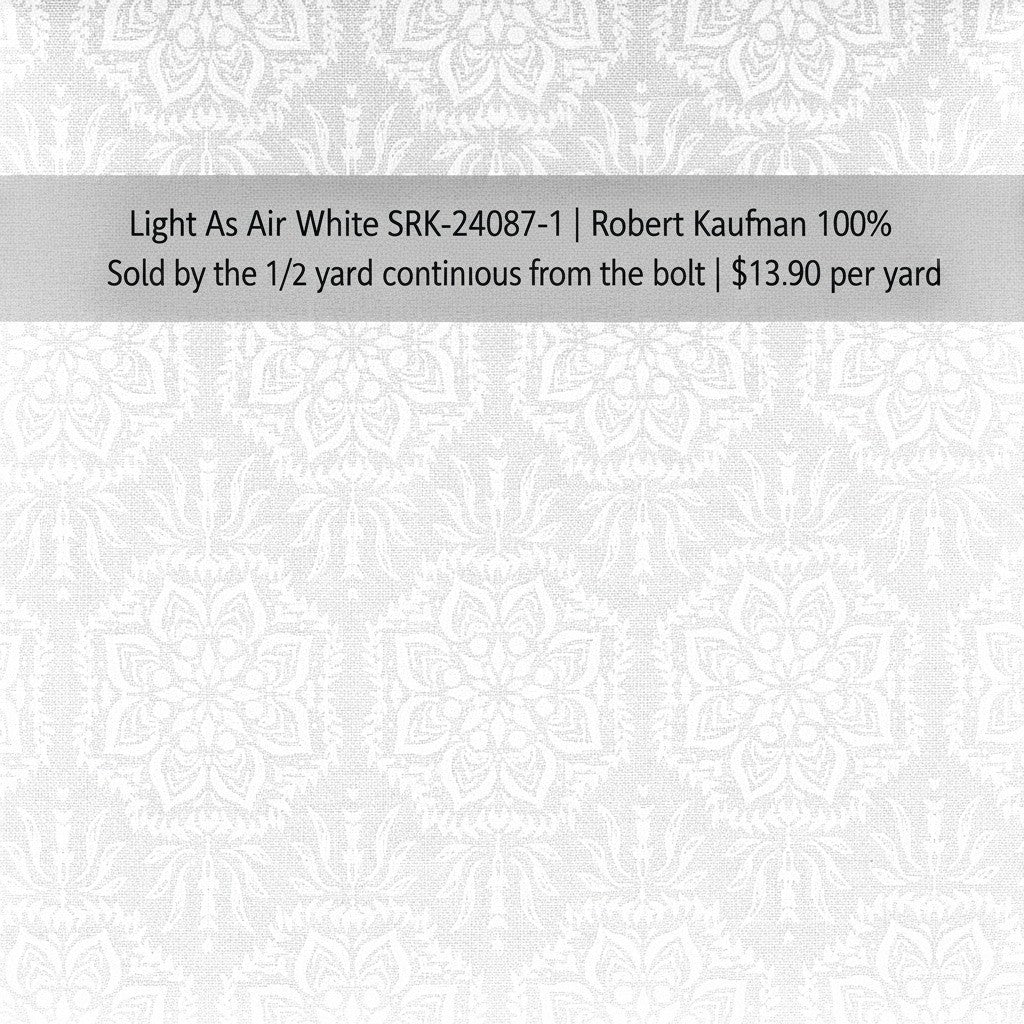 Carmon's Quilt Shop white Robert Kaufman 100% cotton quilting fabric with an elegant airy floral pattern