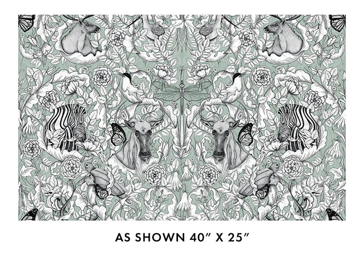 Patterned fabric with animals and flowers on a green background, size 40" x 25".
