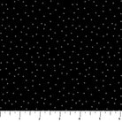 Black fabric with white polka dots and a ruler at the bottom