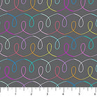 Colorful wavy line pattern on gray fabric with a ruler at the bottom.