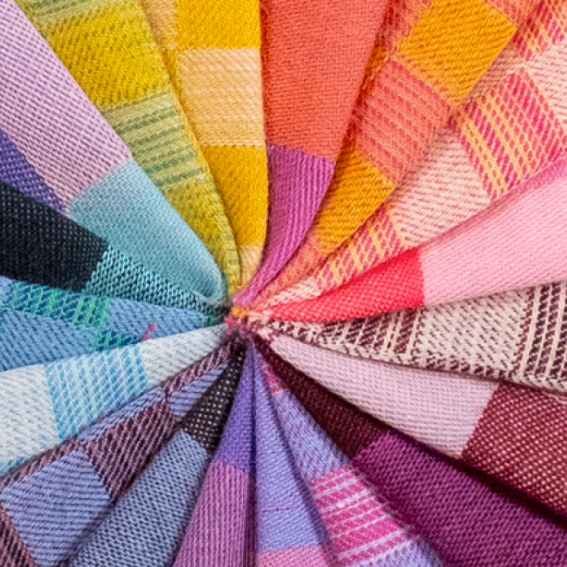 Color swatch with various fabric textures and colors arranged in a circular pattern.