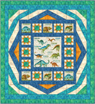 Quilt with dinosaur-themed blocks and a blue border