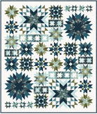 Quilt with star and block patterns in blue, green, and white on a white background