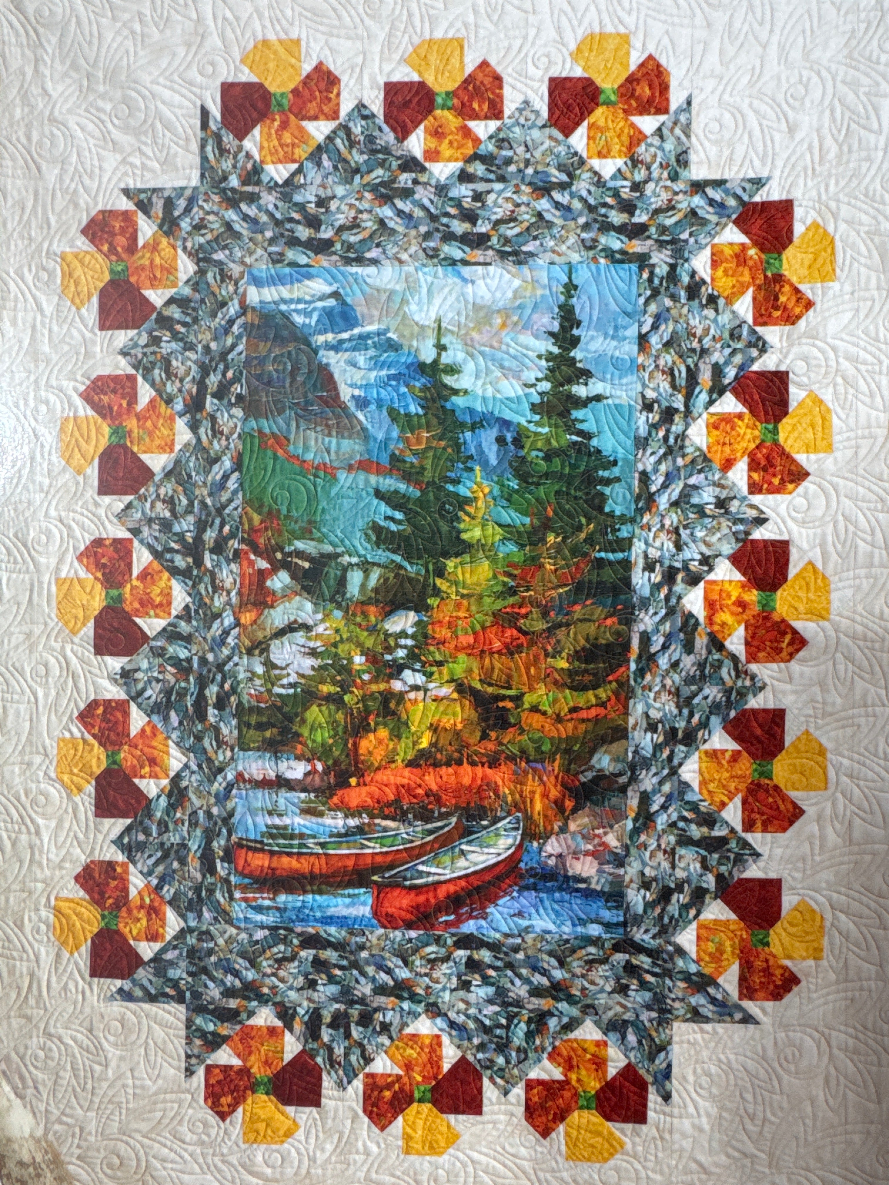 Quilt with a nature-themed design featuring trees, mountains, and colorful borders. Building Quilts With Panels Pattern Book - 4th & Main Designs- Carmon's Quilt Shop 