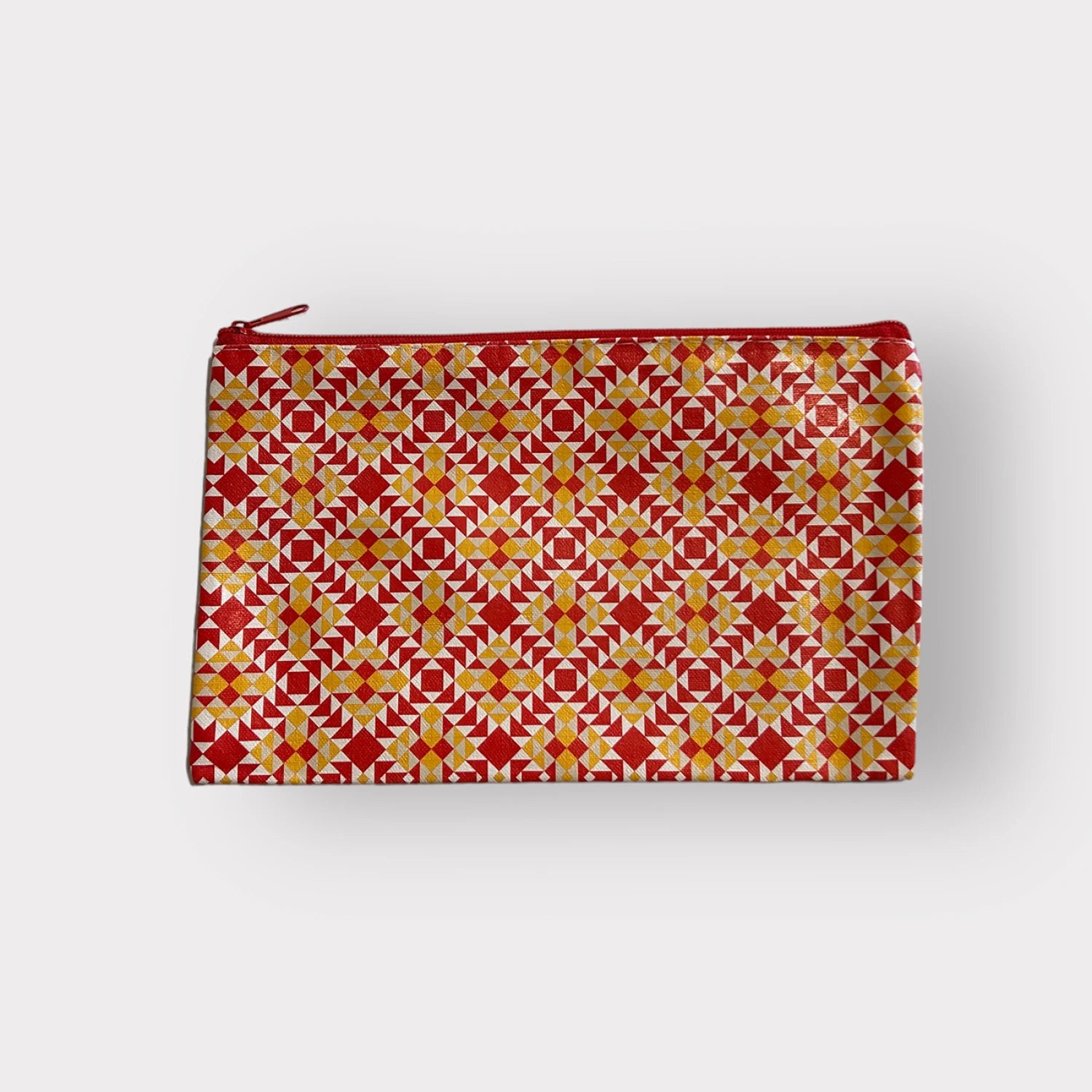 Pouch with red and yellow geometric pattern on a white background